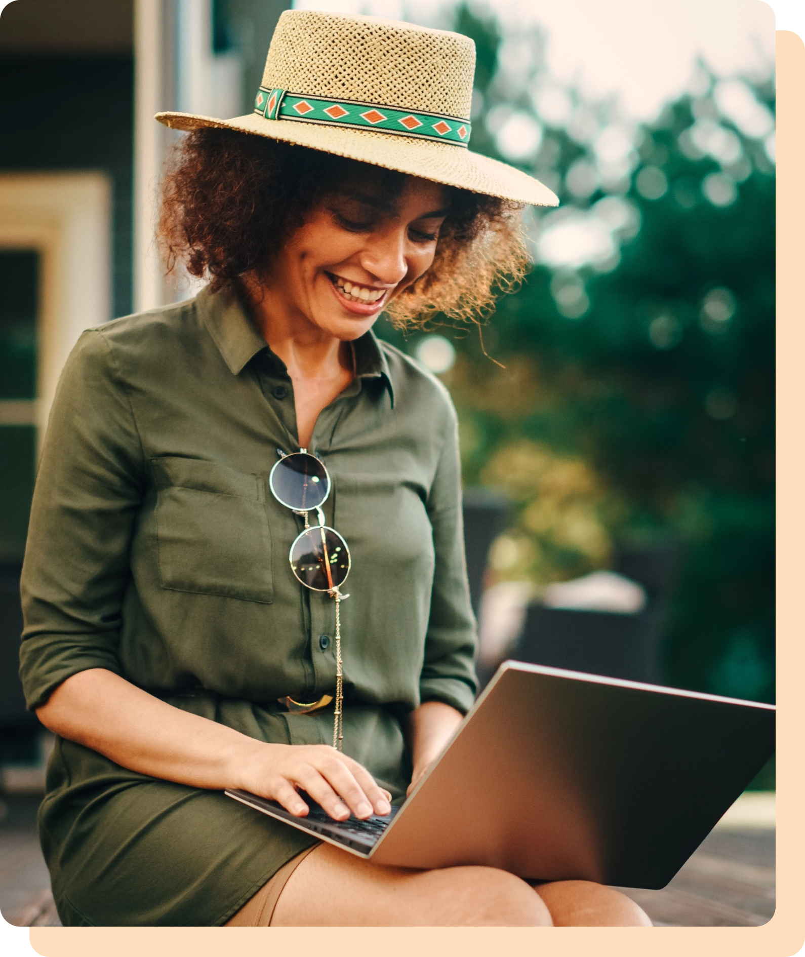 woman smiling while working at computer